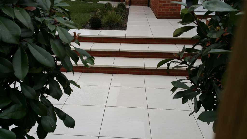 stylish patio with white sqaure porcelain tiles